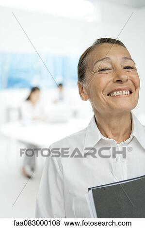 Senior businesswoman, smiling View Large Photo Image Stock Photo - Senior businesswoman, smiling. Fotosearch