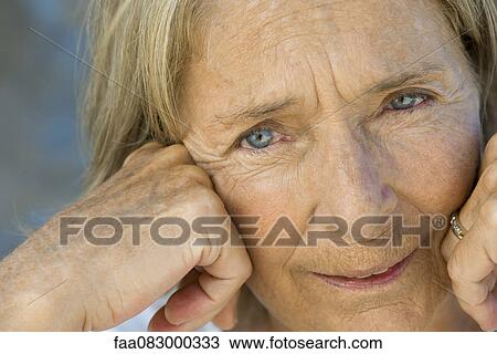 Stock Image - Senior woman, portrait. Fotosearch