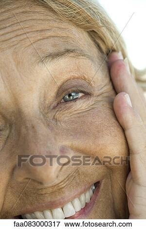 Senior woman smiling, close-up portrait View Large Photo Image Stock Photo - Senior woman smiling, close-up portrait. Fotosearch
