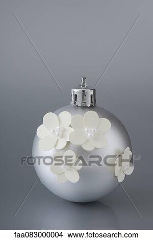 Picture - Silver Christmas ornament decorated with flowers. Fotosearch