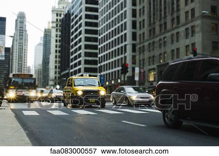 Taxi in downtown Chicago traffic View Large Photo Image Stock Photo - Taxi in downtown Chicago traffic. Fotosearch