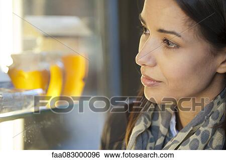 Woman window shopping View Large Photo Image Stock Photograph - Woman window shopping. Fotosearch
