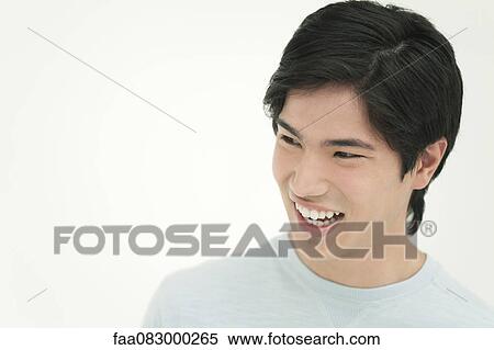 Stock Photography - Young man laughing, portrait. Fotosearch