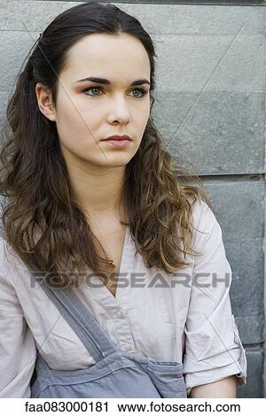 Stock Image - Young woman outdoors, portrait. Fotosearch