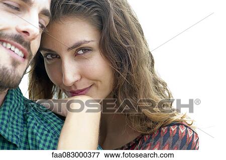 Stock Photo - Young woman resting head on man's shoulder, portrait. Fotosearch