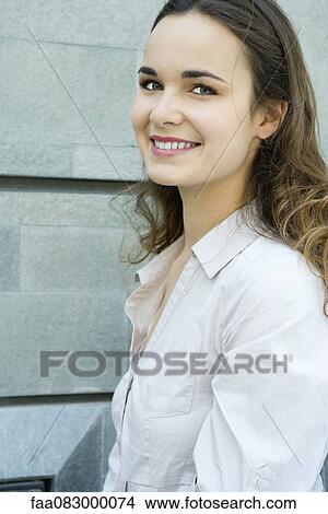 Young woman smiling, portrait View Large Photo Image Picture - Young woman smiling, portrait. Fotosearch