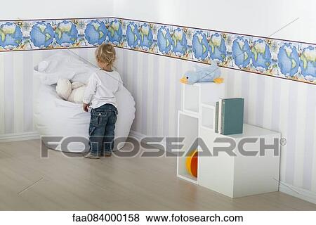Baby boy playing in nursery View Large Photo Image Stock Photo - Baby boy playing in nursery. Fotosearch