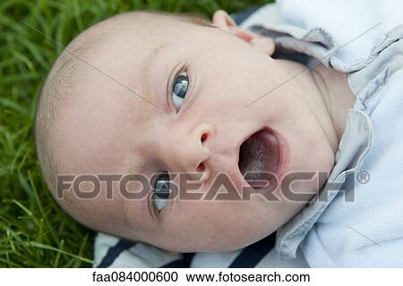 Baby boy with open mouth, portrait View Large Photo Image Stock Image - Baby boy with open mouth, portrait. Fotosearch