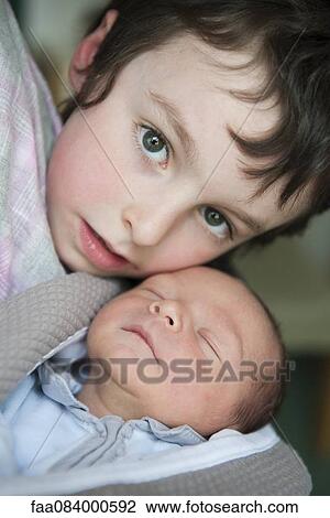 Boy and baby brother, portrait View Large Photo Image Stock Image - Boy and baby brother, portrait. Fotosearch