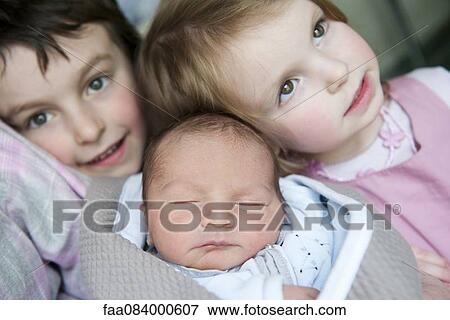 Boy and girl with baby brother View Large Photo Image Stock Photo - Boy and girl with baby brother. Fotosearch