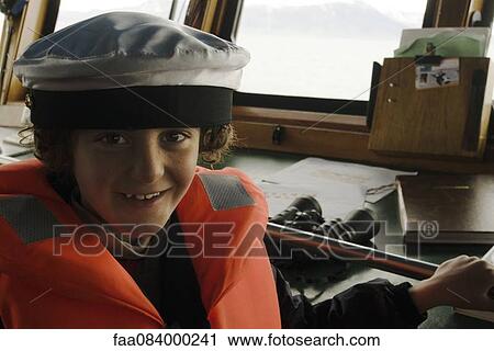 Boy playing captain, cockpit View Large Photo Image Stock Image - Boy playing captain, cockpit. Fotosearch