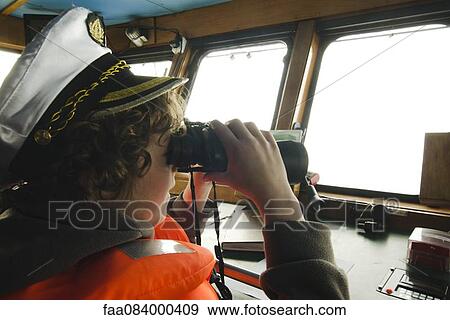 Boy playing captain, cockpit View Large Photo Image Stock Photo - Boy playing captain, cockpit. Fotosearch