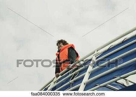 Boy smiling face on the horizon, on the upper deck of a boat View Large Photo Image Stock Photography - Boy smiling face on the horizon, on the upper deck of a boat. Fotosearch