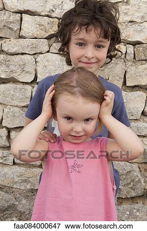 Stock Photo - Brother and sister, portrait. Fotosearch