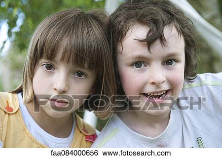 Stock Photograph - Brother and sister, portrait. Fotosearch