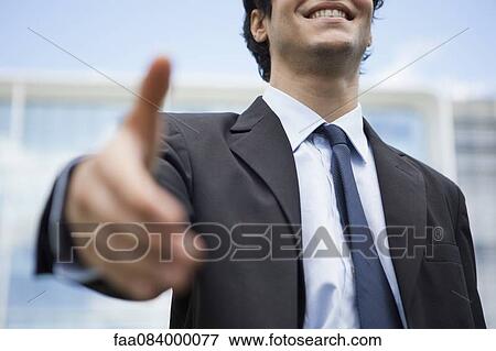 Businessman extending hand for handshake, mid section View Large Photo Image Stock Photo - Businessman extending hand for handshake, mid section. Fotosearch