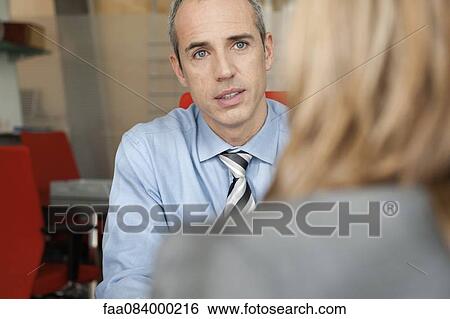 Businessman meeting with client View Large Photo Image Stock Photograph - Businessman meeting with client. Fotosearch