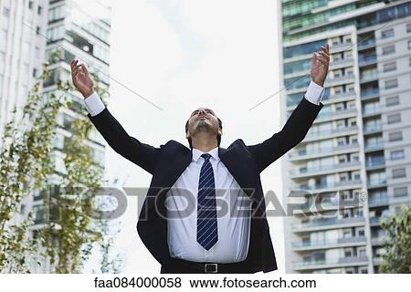 Businessman with arms outstretched View Large Photo Image Stock Photo - Businessman with arms outstretched. Fotosearch