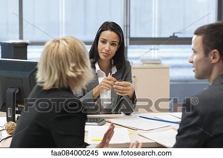 Businesswoman meeting with business partners in office View Large Photo Image Stock Photography - Businesswoman meeting with business partners in office. Fotosearch