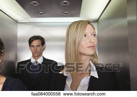 Businesswoman on elevator View Large Photo Image Stock Photo - Businesswoman on elevator. Fotosearch