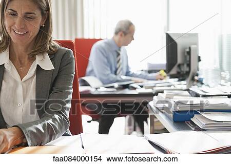 Businesswoman working in office View Large Photo Image Picture - Businesswoman working in office. Fotosearch