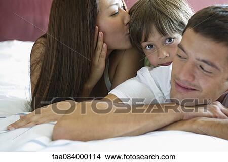 Family relaxing together, portrait View Large Photo Image Picture - Family relaxing together, portrait. Fotosearch