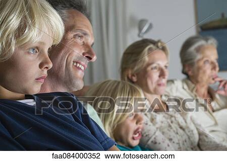 Family watching TV together View Large Photo Image Stock Image - Family watching TV together. Fotosearch