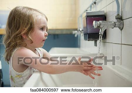 Little girl washing hands View Large Photo Image Stock Photo - Little girl washing hands. Fotosearch
