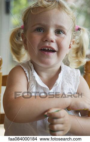 Picture - Little girl with pigtails, portrait. Fotosearch