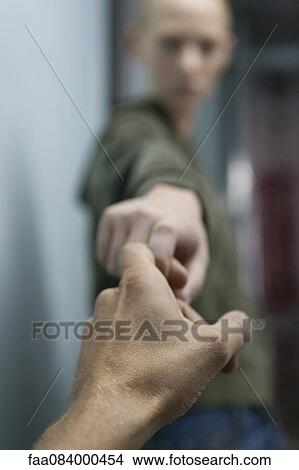 Man's hand reaching to hold woman's hand View Large Photo Image Picture - Man's hand reaching to hold woman's hand. Fotosearch