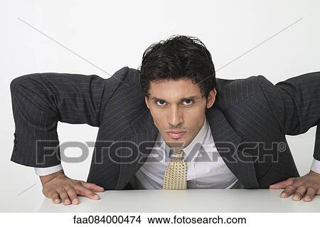 Picture - Mid-adult businessman. Fotosearch