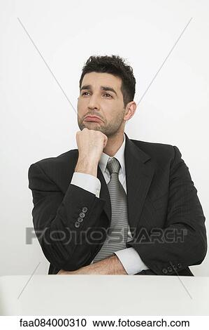 Mid-adult businessman with sad face View Large Photo Image Stock Image - Mid-adult businessman with sad face. Fotosearch