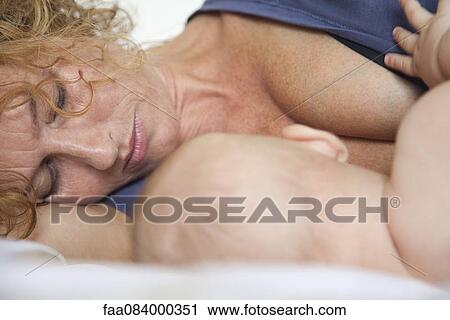 Mother and baby resting together View Large Photo Image Stock Image - Mother and baby resting together. Fotosearch
