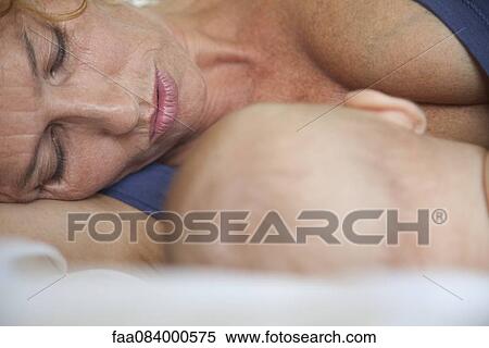 Mother and baby resting together View Large Photo Image Stock Photography - Mother and baby resting together. Fotosearch