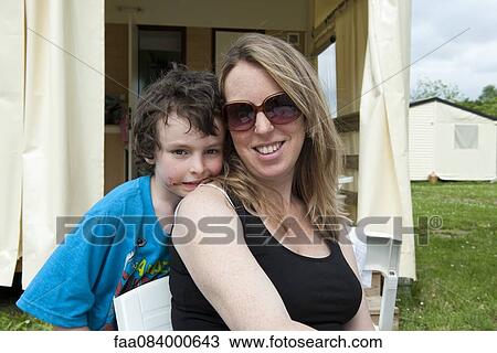 Mother and son together outdoors, portrait View Large Photo Image Stock Image - Mother and son together outdoors, portrait. Fotosearch