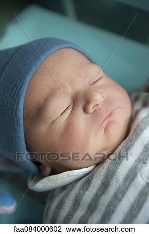 Stock Image - Newborn baby sleeping. Fotosearch