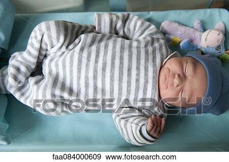 Newborn baby sleeping View Large Photo Image Stock Photo - Newborn baby sleeping. Fotosearch