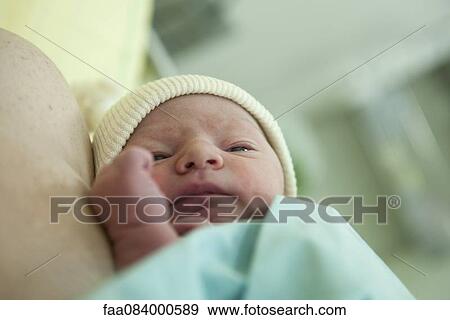 Stock Photo - Newborn baby. Fotosearch