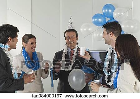 Stock Photo - Office celebration, business people making a toast. Fotosearch