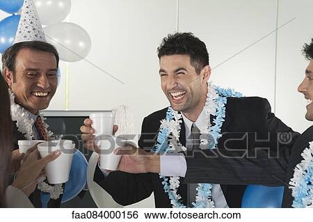 Stock Photograph - Office celebration, business people making a toast. Fotosearch