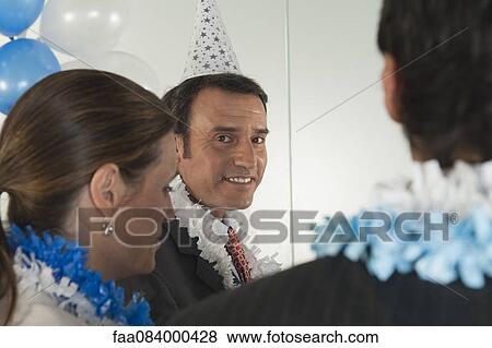 Office celebration, mature businessman looking at camera View Large Photo Image Stock Photo - Office celebration, mature businessman looking at camera. Fotosearch