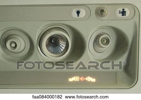 Stock Image - Panel ventilation and lighting for traveling by plane. Fotosearch