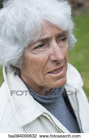 Senior woman looking away in thought, portrait View Large Photo Image Stock Image - Senior woman looking away in thought, portrait. Fotosearch