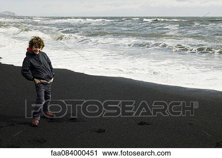 Smiling boy on beach iceland View Large Photo Image Stock Image - Smiling boy on beach iceland. Fotosearch