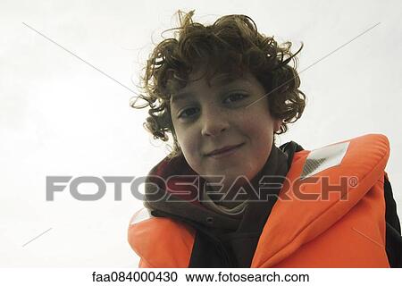 Smiling boy with a lifejacket View Large Photo Image Stock Image - Smiling boy with a lifejacket. Fotosearch