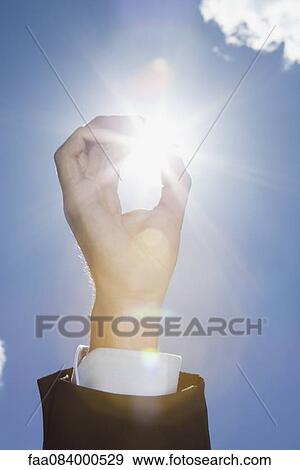Sunlight through fingers, cropped View Large Photo Image Stock Photo - Sunlight through fingers, cropped. Fotosearch