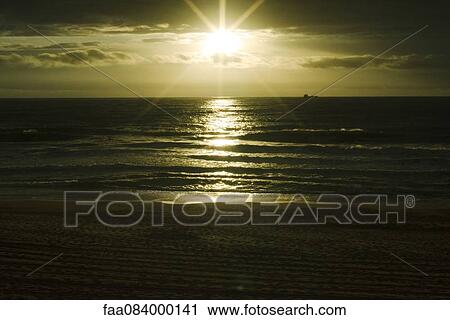 Sunset over the Atlantic Ocean, ship on the horizon, Ondres France View Large Photo Image Stock Image - Sunset over the Atlantic Ocean, ship on the horizon, Ondres France. Fotosearch