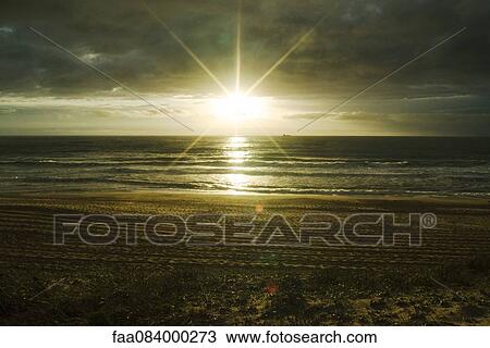 Sunset over the Atlantic Ocean, ship on the horizon, Ondres France View Large Photo Image Stock Image - Sunset over the Atlantic Ocean, ship on the horizon, Ondres France. Fotosearch