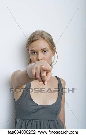 Teenage girl pointing at camera View Large Photo Image Stock Image - Teenage girl pointing at camera. Fotosearch