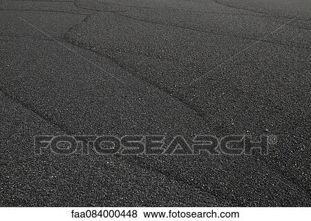 Stock Photo - Traces on the sea of black sand, iceland. Fotosearch